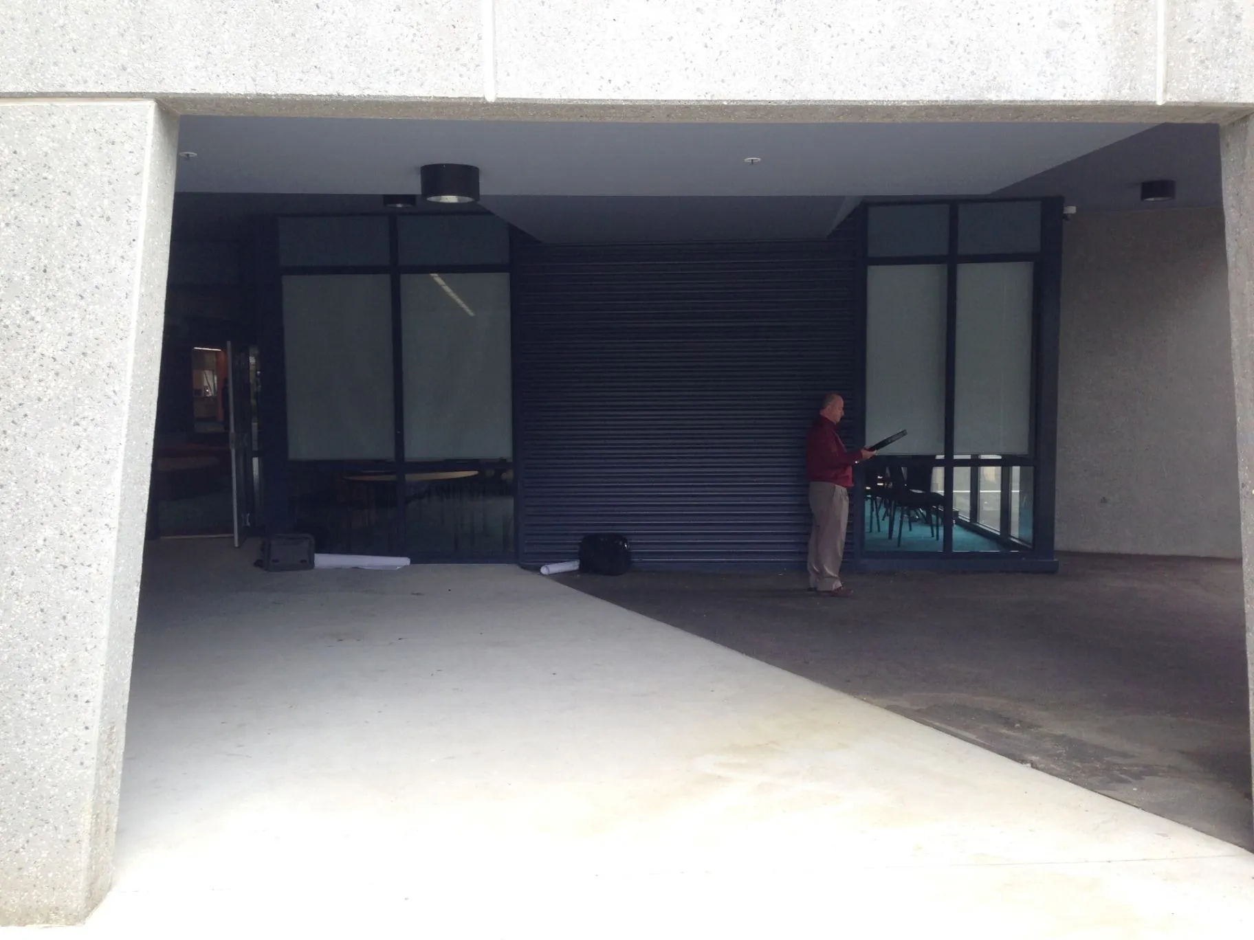 Existing Monash building entry and covered approach before the update