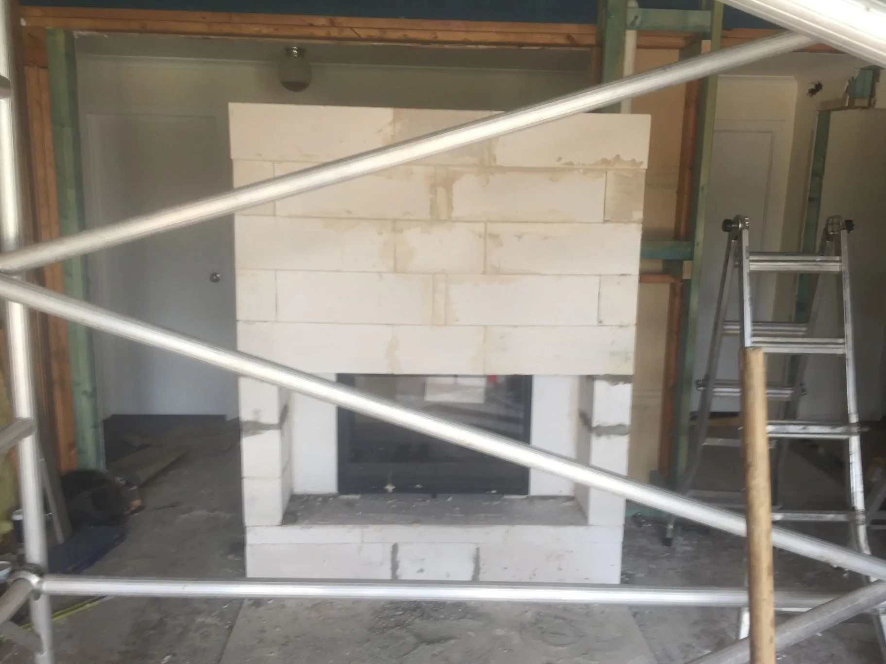 Fireplace under construction inside the Kyneton home