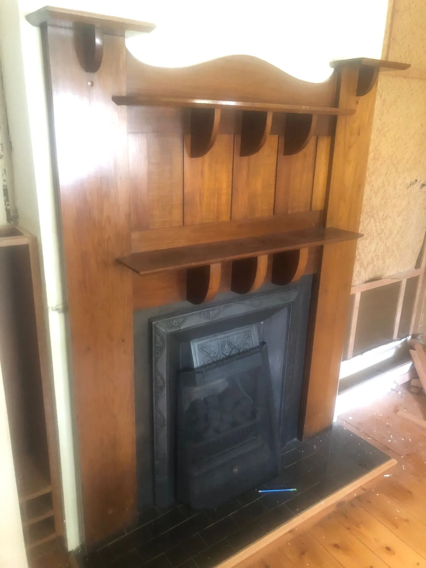 Original timber mantel and fireplace in the Oakleigh home